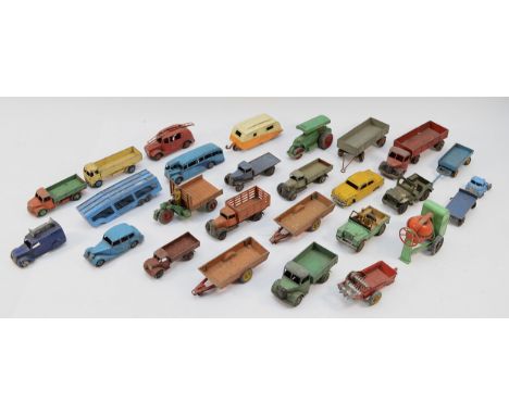 A collection of mid 20th century Dinky diecast model vehicles and implements, to include trucks, trailers, cement mixer, cara