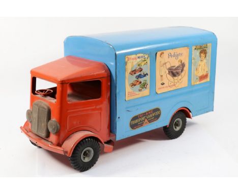 A Tri-ang large scale tinplate transport van No.200, made in England circa 1950s 'Lines Bros Ltd London' having red cab and b