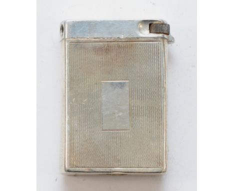 A silver petrol lighter, marked 'SILVER', 5cm.