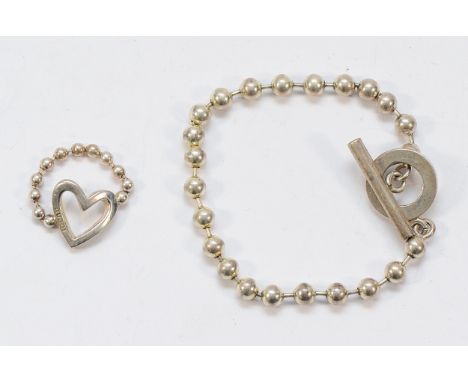 Gucci, a 925 silver beaded heart shaped ring, M, together with a similar style 925 silver beaded bracelet with T bar closure,