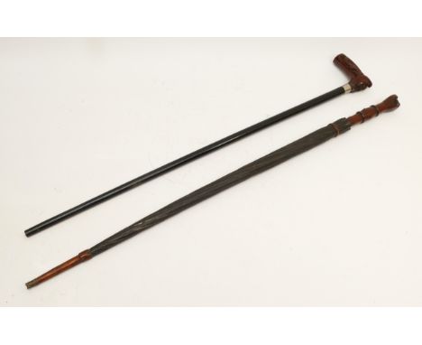 Two mid 20th century walking sticks, including a carved stick in the form of a parasol and an ebonised example having carved 