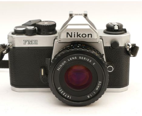 A Nikon FM2 film camera, with a Nikon Series E f/1.8 50mm lens.