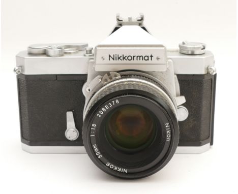 A Nikkormat 35mm film camera with a Nikon Nikkor f/1.8 50mm lens.