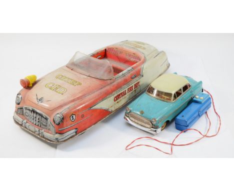 A 1950s/60s tinplate battery operated 'Chief Central Fire Department' car, length 50cm, together with a 1960s tinplate 'Opel 