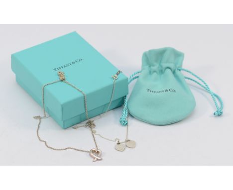 Tiffany &amp; Co, Paloma Picasso, heart shaped pendant on a chain, together with a Tiffany &amp; Co double heart tag pendant 