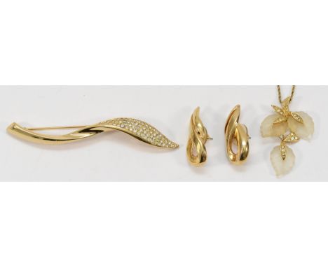 Christian Dior, a gilt metal and gemstone brooch, 95mm, a pair of Christian Dior gilt metal earrings, 35mm, with a Christian 