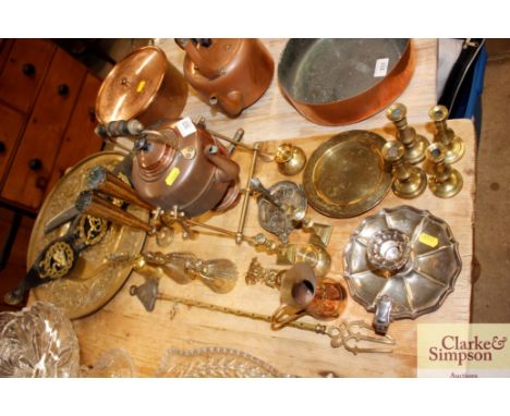 A copper kettle on spirit heater stand; various decorative brassware; plated chamber stick; horse brasses etc