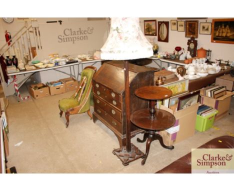 A carved oak standard lamp with floral shade 