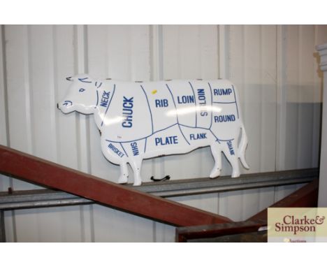 An enamel cow sign