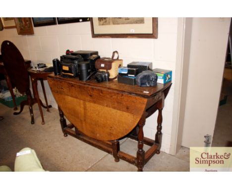 A antique oak gate leg dining table 