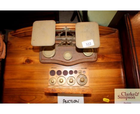 A set of postal scales and some weights in fitted box 