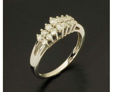 A 14 ct white gold fourteen stone diamond ring, stamped "14 k", size N/O.