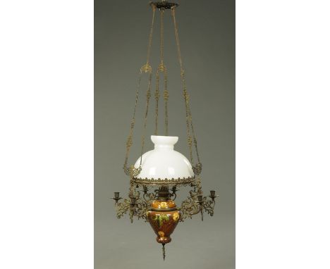 A late Victorian ceiling mounting oil lamp, with earthenware reservoir and metal frame.  Shade diameter 35 cm.    CONDITION R