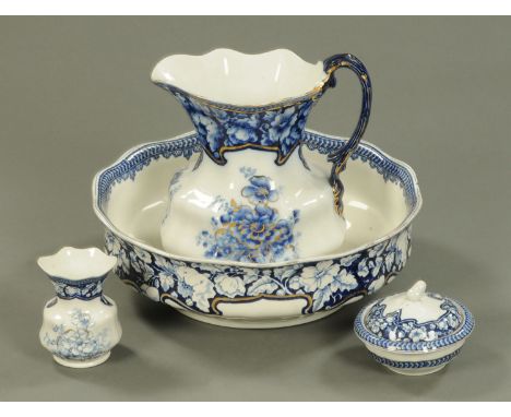 A Corona Ware toilet jug, basin, vase and soap dish.