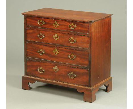 A George III mahogany chest of drawers, with four long graduated drawers with brass drop handles and raised on bracket feet. 
