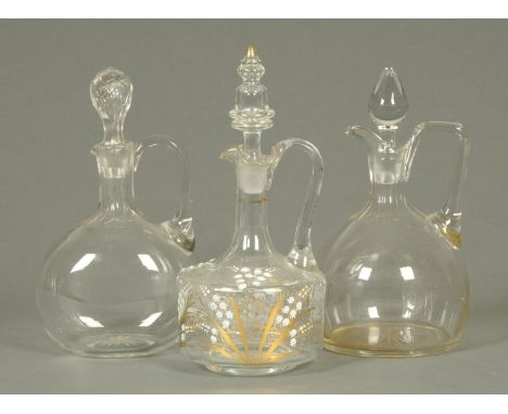 A Victorian glass decanter, decorated with lily of the valley, and two others.    CONDITION REPORT:  Decanter one has a stopp
