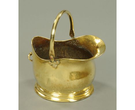 A brass coal helmet, with loop handle.