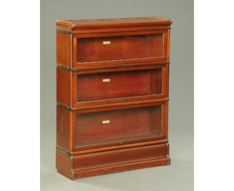 A Globe-Wernicke Company three tier mahogany sectional bookcase.  Width 87 cm.    CONDITION REPORT:  There are light surface 