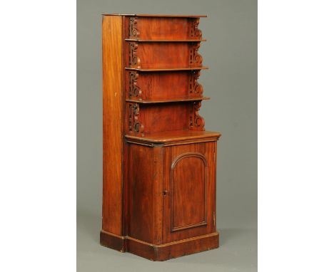 A Victorian mahogany combined shelf cupboard and leaf holder, each shelf with fretwork supports.  Width 63 cm. 