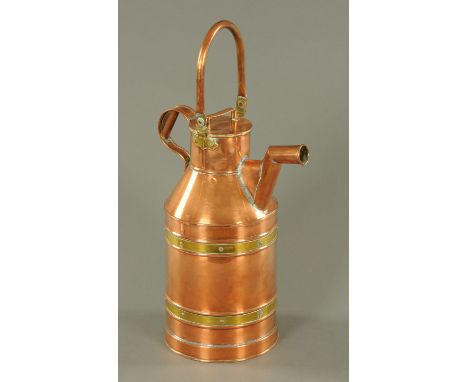 A large brass and copper flask, with loop carrying handle.  Height including handle 65 cm. 