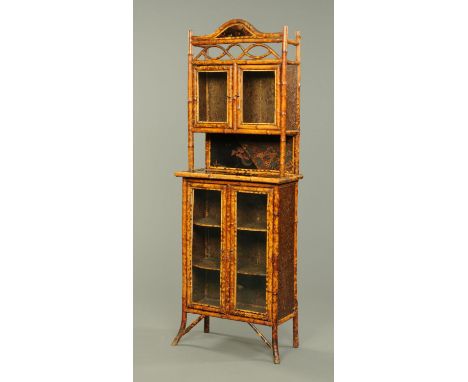 A Victorian bamboo and Chinoiserie lacquered side cabinet, with glazed cupboard, open shelf and splayed feet.  Width 73 cm.  