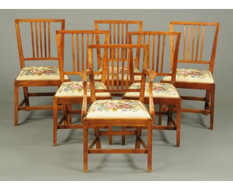 A set of six 19th century dining chairs, yew wood and fruitwood, one arm and five single chairs, with tapestry seats raised o