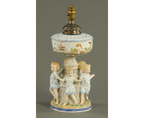 A Continental porcelain light fitting, children dancing around a column.  Height including light fitting 38 cm.    CONDITION 