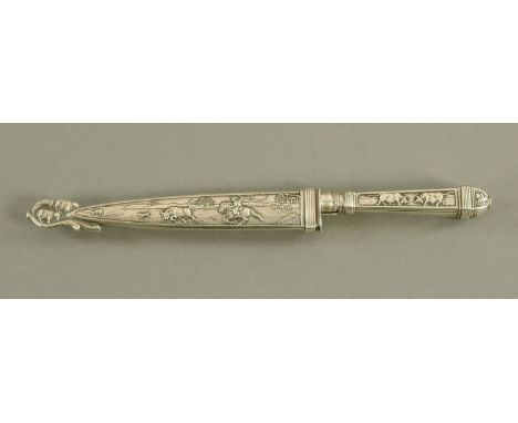 A South American Gaucho knife, with scabbard, stainless steel.  Length 29 cm.    CONDITION REPORT:  Both the knife and scabba