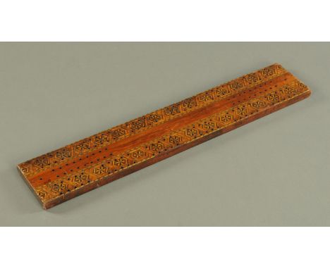 A Victorian marquetry cribbage board, large form.  Length 60 cm. 