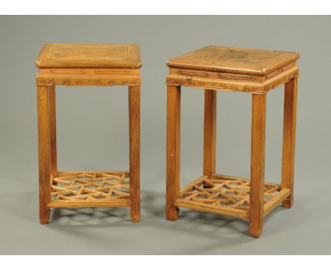 A pair of Chinese wooden urn stands, each with square top, carved frieze and low latticework shelf.  Height 76 cm, width 47 c