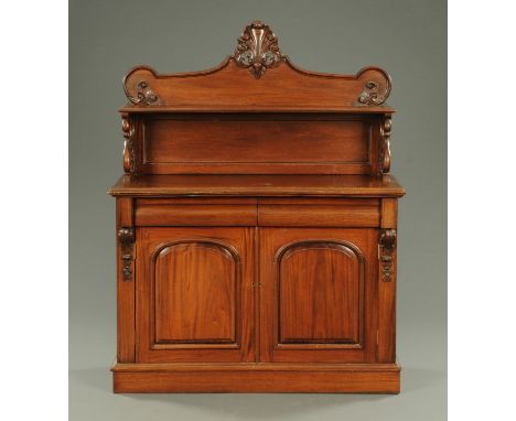 A Victorian mahogany chiffonier, with rear upstand and shelf, the base fitted with two drawers and pair of panelled cupboard 