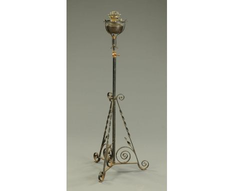 A Victorian wrought iron lamp standard, with telescopic action.