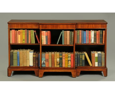 A late Victorian mahogany breakfront low bookcase, with rounded corners and raised on bracket feet.  Width 140 cm.    CONDITI