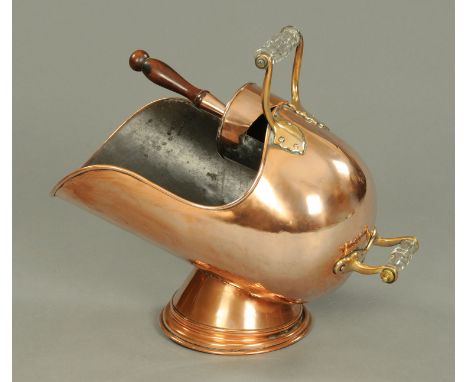 A Victorian copper coal helmet, with glass handle and scoop.