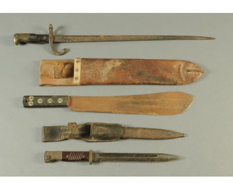 A 1942 military machete, dated to the leather scabbard, an 1877 bayonet and a World War Two Mauser bayonet.  