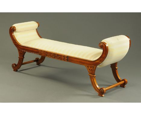 A reproduction window seat, in the Regency style, upholstered in pale striped fabric.  Width 180 cm.    CONDITION REPORT:  Th