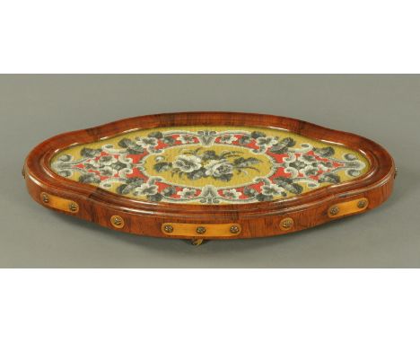 A Victorian rosewood framed beadwork and woolwork tapestry table centre, raised on four short castors.  Length 58 cm.    COND