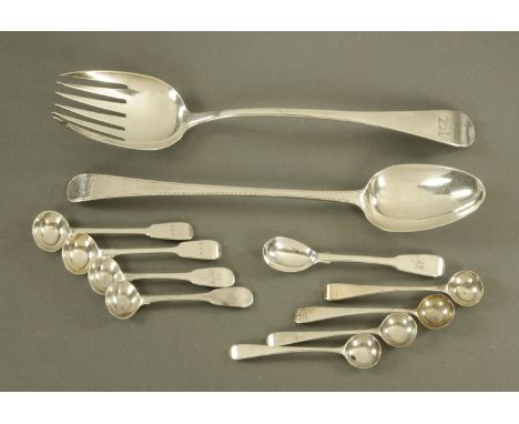 A Georgian silver bright cut bottom marked spoon, London hallmark rubbed, a George III silver slatted serving spoon, London 1