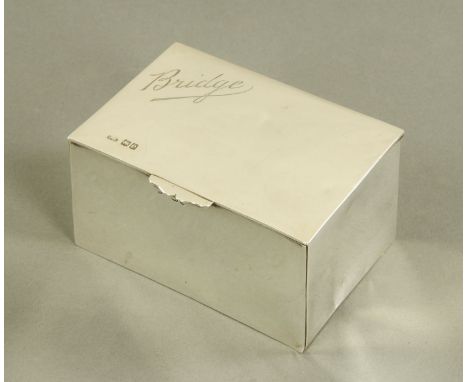 A silver playing card casket, inscribed "Bridge", London 1900.  Width 11.5 cm.    CONDITION REPORT:  Weight 440 grams.  Maker