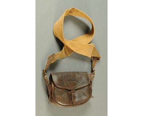 A vintage leather ammunition bag.