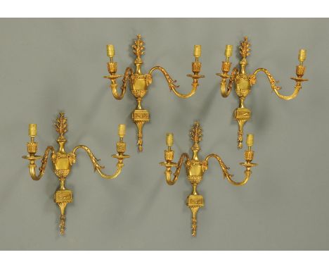 A set of four Edwardian two branch gilt brass light fittings.  Height 43 cm (see illustration).   CONDITION REPORT:  All four