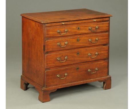 A George III mahogany chest of drawers, with slide above four long graduated drawers with brass drop handles and all raised o