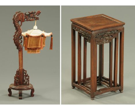 A Chinese carved wooden table lamp with shade, and a nest of three Chinese vase stands, largest width 24 cm.    CONDITION REP