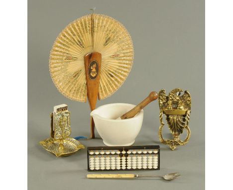 A brass eagle door knocker, a matchbox holder, Sorrento fan, abacus, ivory handled pickle fork and a pestle and mortar.  