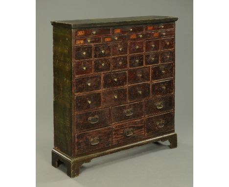 A 19th century green painted chest of small drawers, raised on bracket feet.  Width 117 cm, depth 34 cm, height 125 cm.    CO
