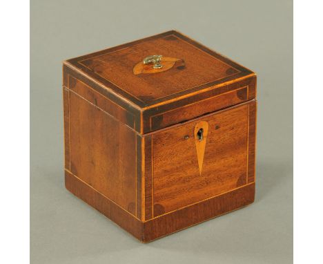 A George III mahogany tea caddy, crossbanded and boxwood strung.  Width 12.5 cm.    CONDITION REPORT:  There is a group of sm
