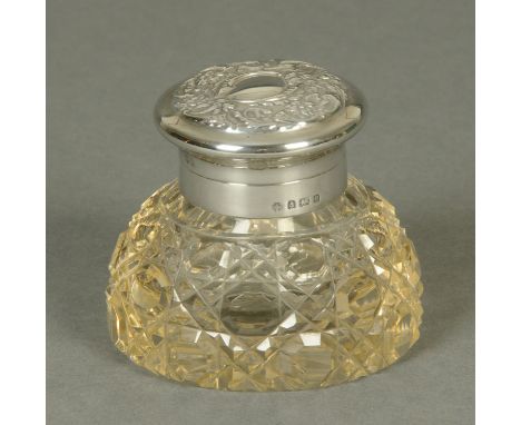 A silver mounted cut glass inkwell, Birmingham 1900.   CONDITION REPORT:  The diameter of the base of the inkwell is 9 cm, he