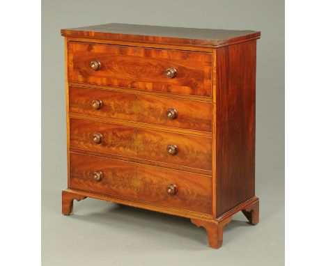A Victorian mahogany chest of drawers, with crossbanded edge and four drawers with wooden knob handle and raised on bracket f