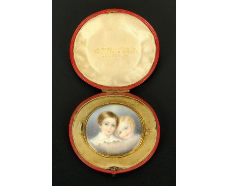 A 19th century oval framed portrait miniature, two children, on ivory, in Pinchbeck mount and with hair back, cased.  Miniatu