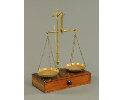 A set of Edwardian mahogany cased balance scales.